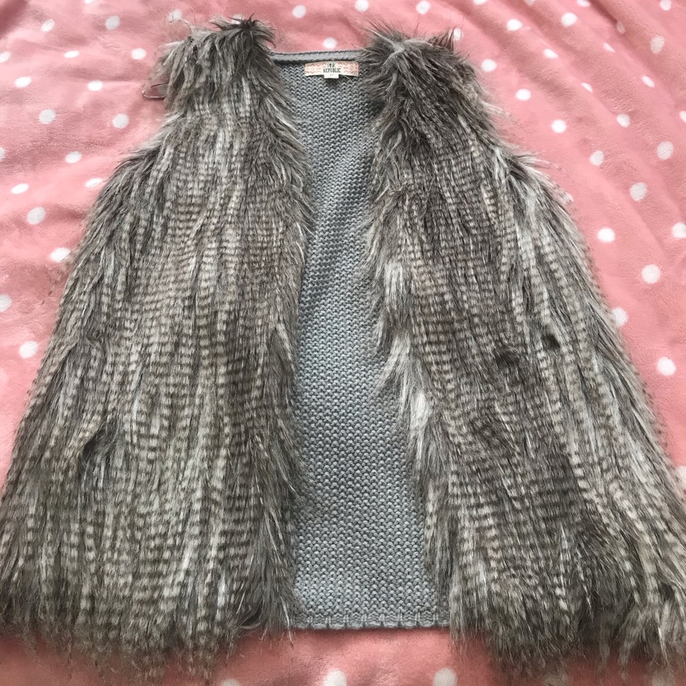 Classy vest, grey, some white and tans mixed in.